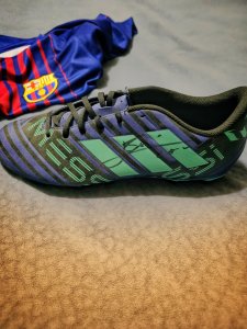 A collector item, a Nemeziz Messi Football Left Boot, hand-signed by Messi himself. A value for Messi fans.